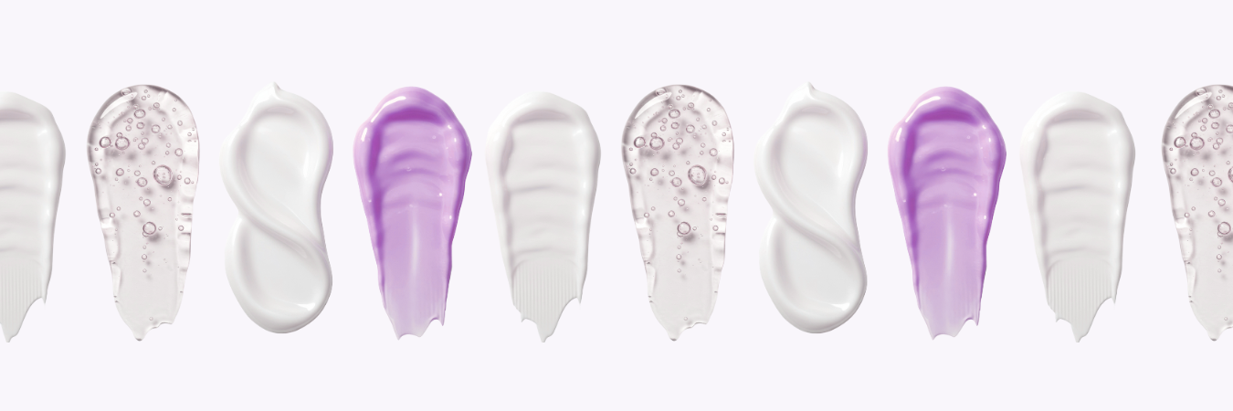 Row of different colored cream swatches on a white background