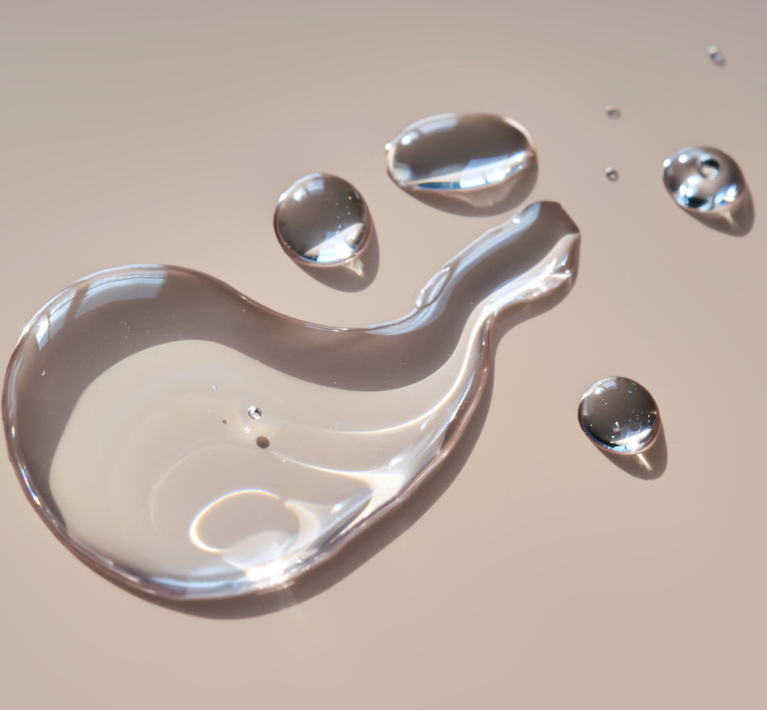 Water droplets on a beige surface